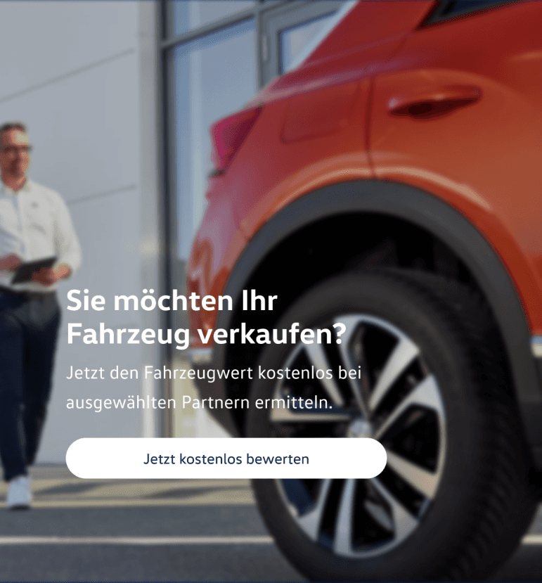 Photo of a red car outside a dealership, overlaid with an offer to have the vehicle valued free of charge