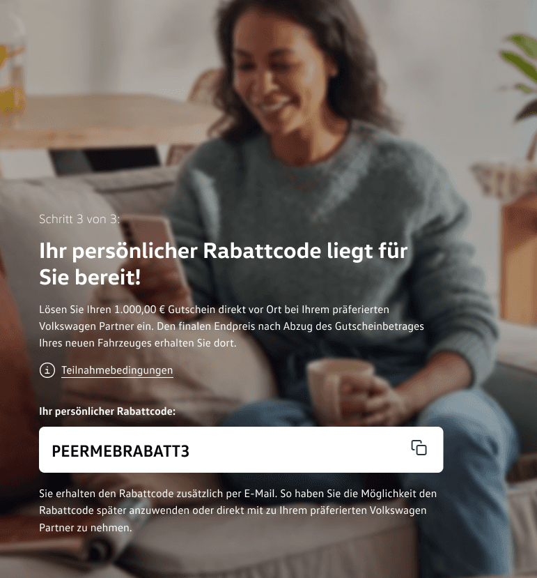 Screenshot of the "voucher feature app" for taking part and retrieving a personal discount code. With a short description of how the voucher can be redeemed and a link to the terms of participation. In the background, blurred, a woman sits smiling on a couch looking at a smartphone.